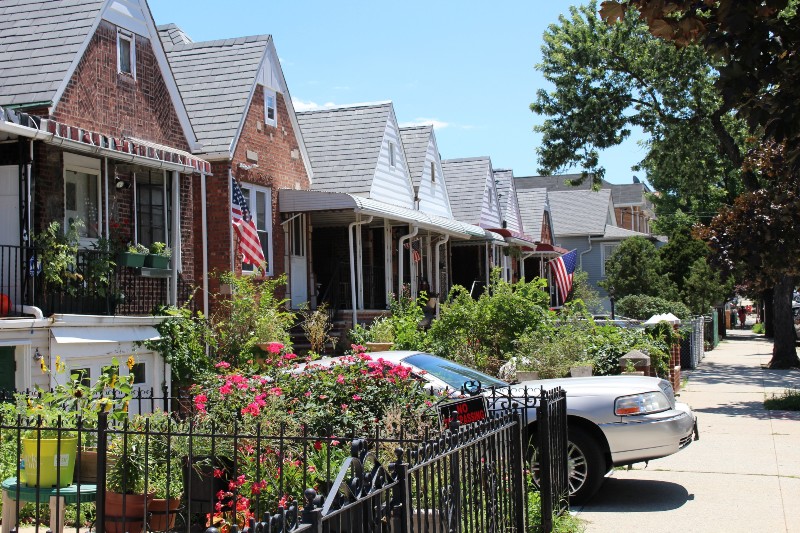 Several homes during a summer afternoon in Queens, New York.