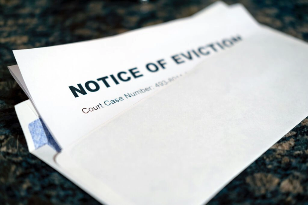 Close-up of an eviction notice letter on a table, symbolizing landlord action against bad tenants in New York for nonpayment or lease violations.